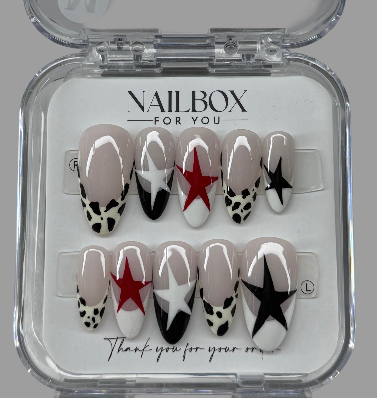 Set of nail art designs in a clear box with 'Nailbox for You' branding.